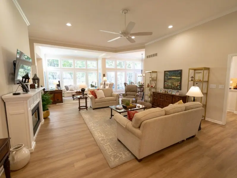 Villa living room with couch and bay windows