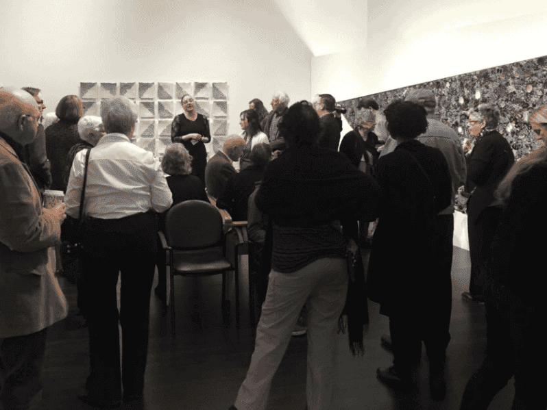 Crowd listening to artist speaker