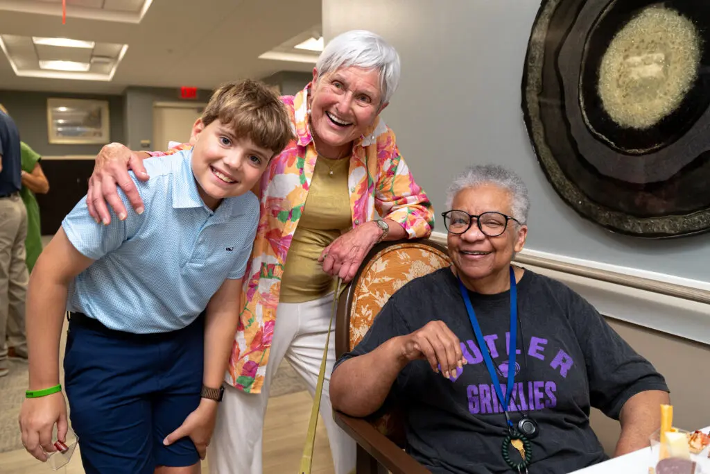 Irene Bettinger, grandson Max, and Memory Care Resident Carolyn